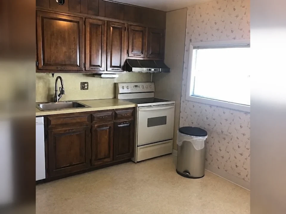 A kitchen before its existing countertops are removed